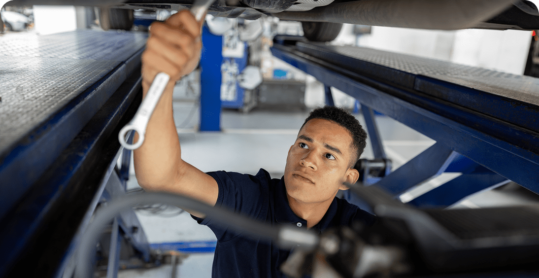 Auto repair specialist using a wrench