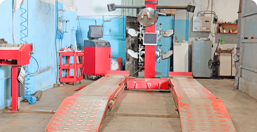Automotive workshop with alignment equipment.